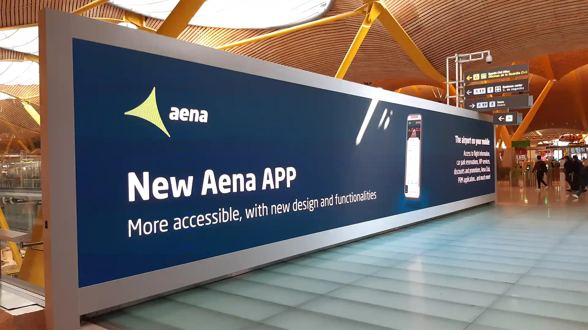Large-format LED screens integrated into Madrid-Barajas airport terminal for high-traffic passenger areas