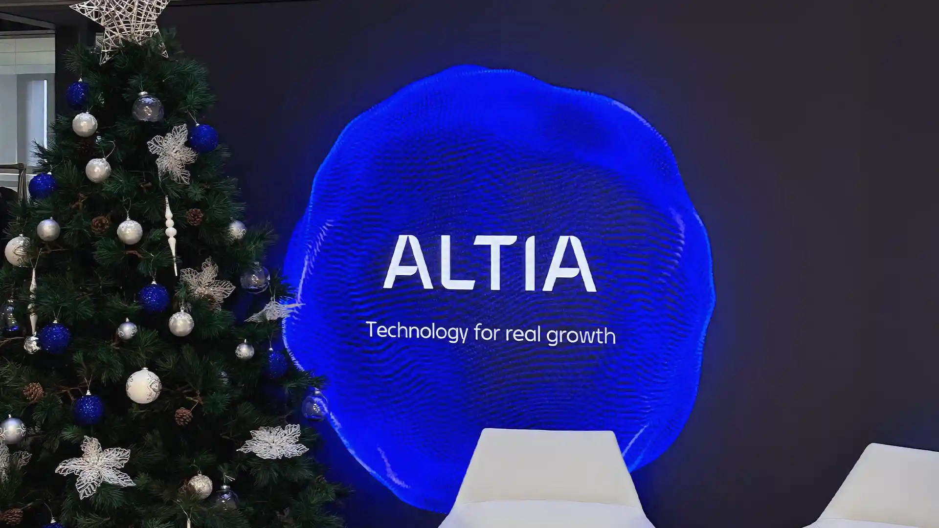 Indoor LED display integrated into a corporate reception environment.