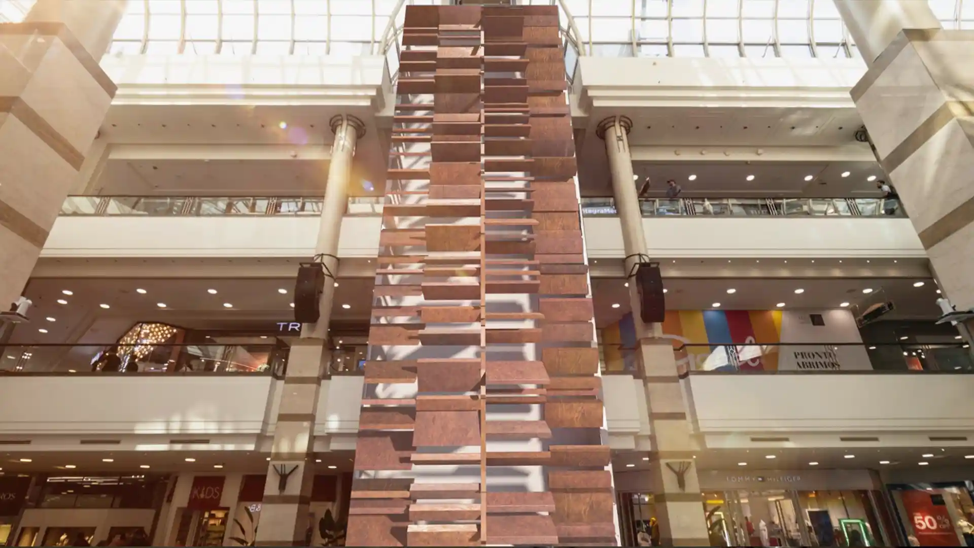 Visitors interacting with immersive 3D visuals and synchronized sound in the central plaza of Alto Las Condes.