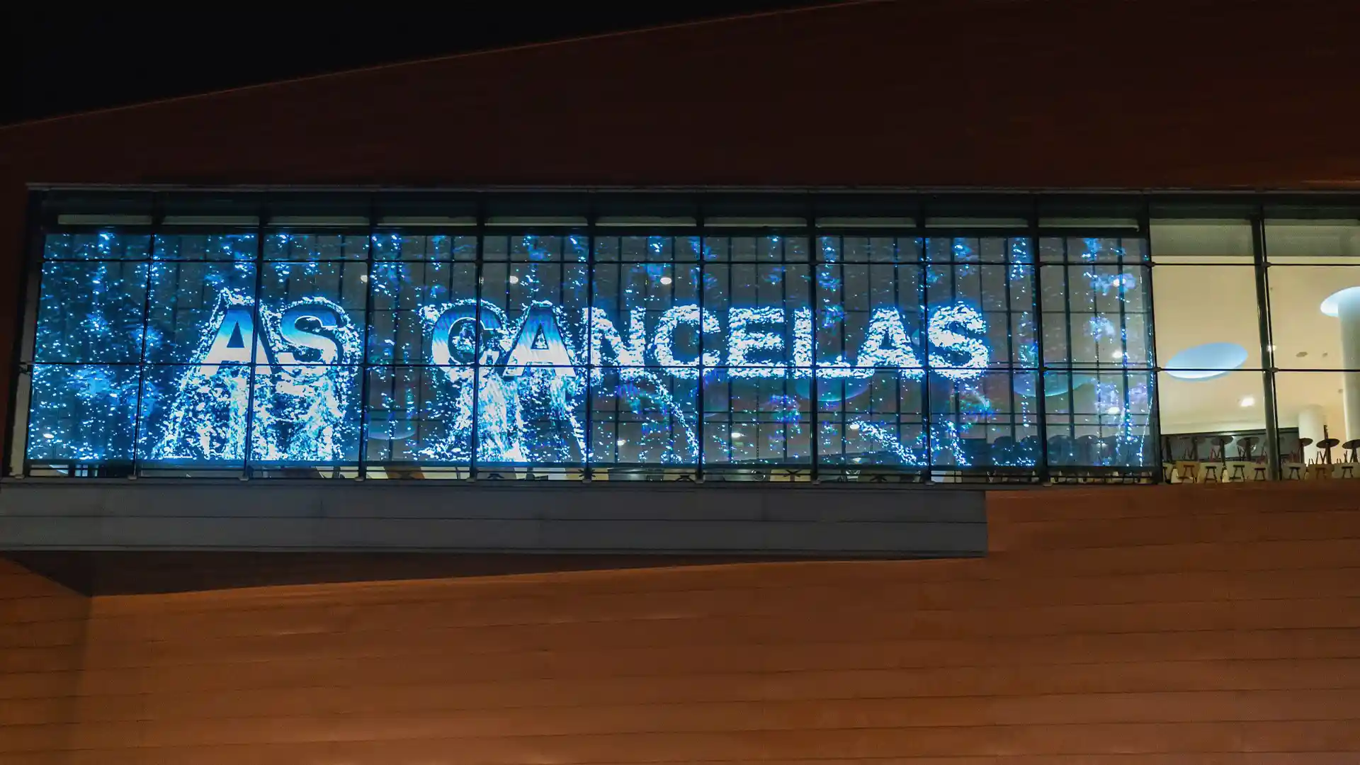 LED screen and digital installations at As Cancelas showing artistic and animated content.