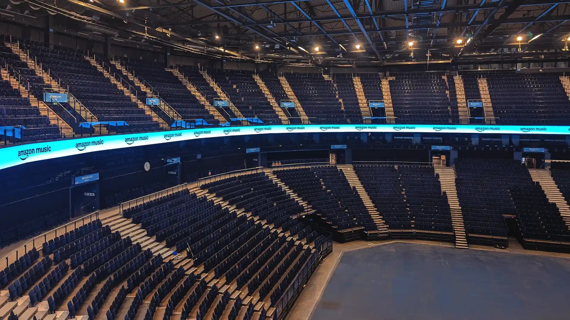 Wide view of the LED ring integrated into the upper seating tier at Barclays Arena.