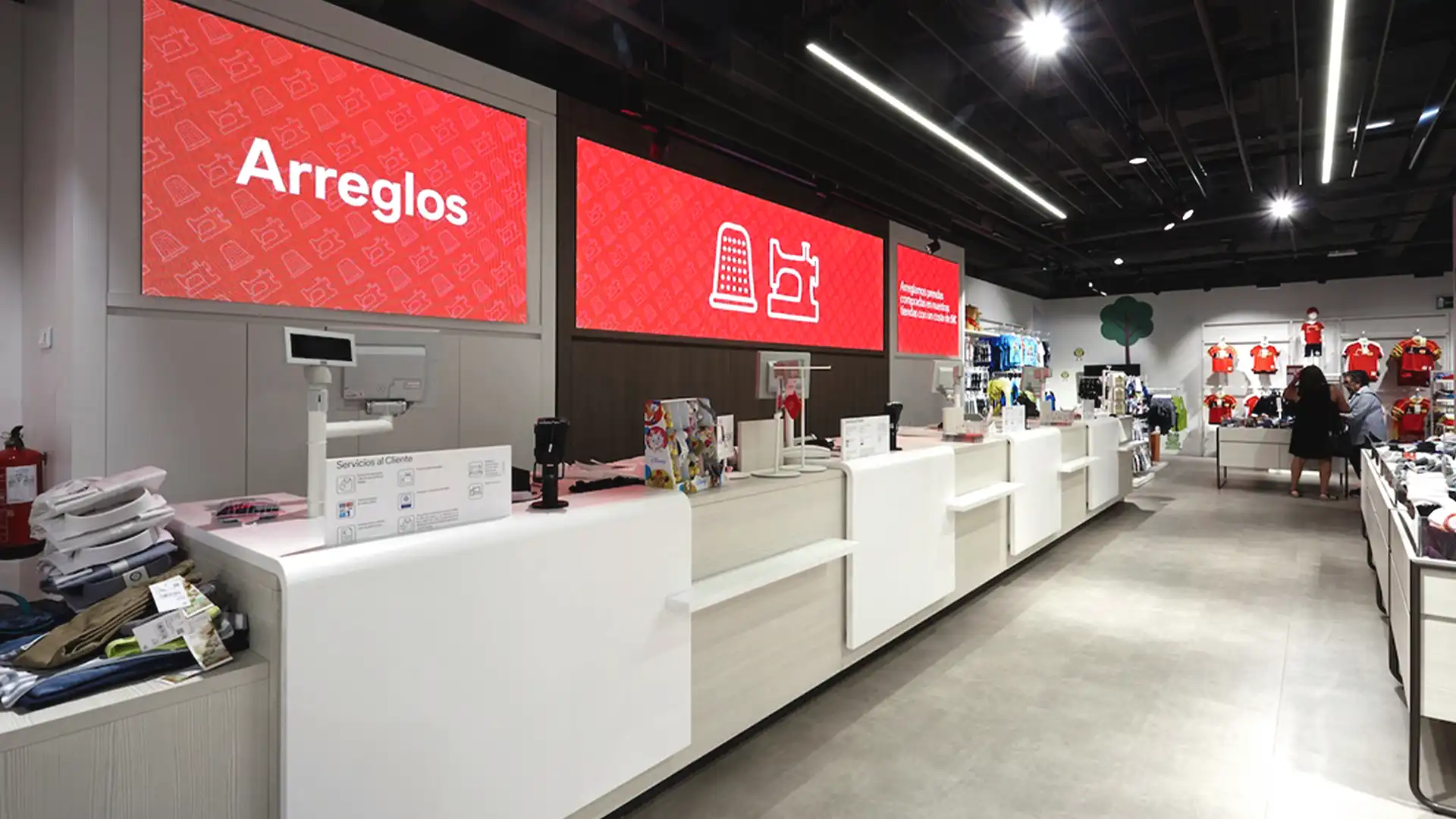 Interior digital signage at C&A showing dynamic offers and collections.