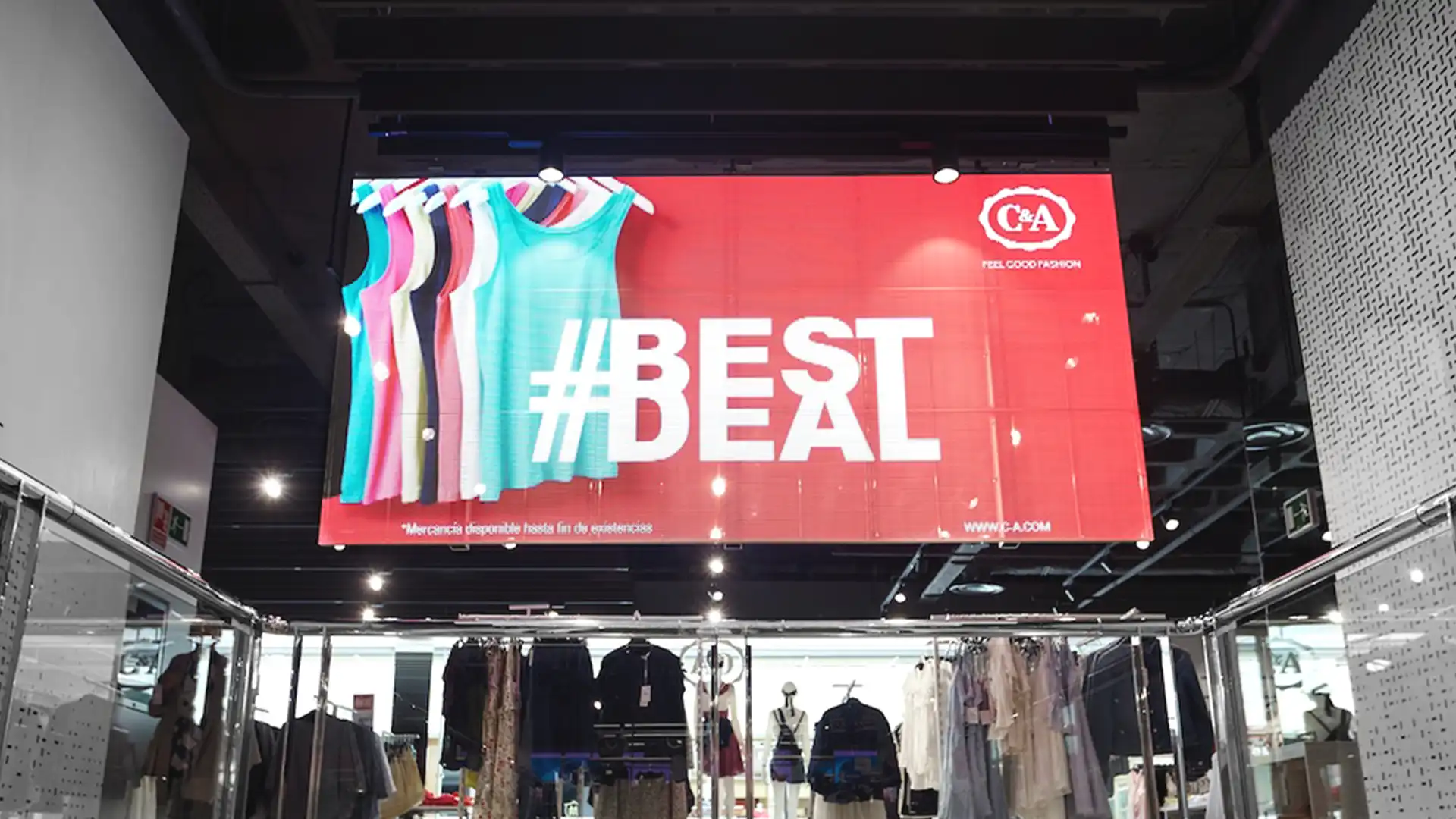 Interior digital screen at C&A displaying dynamic promotional content.