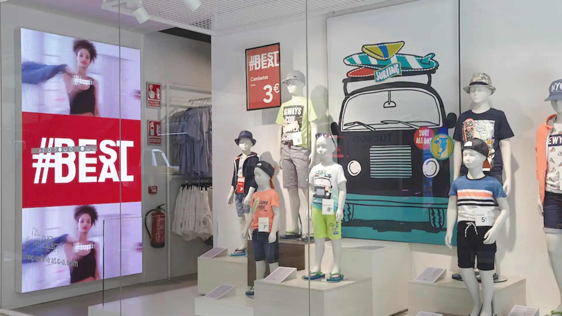 Large-format LED display at C&A store entrance showing promotional content.