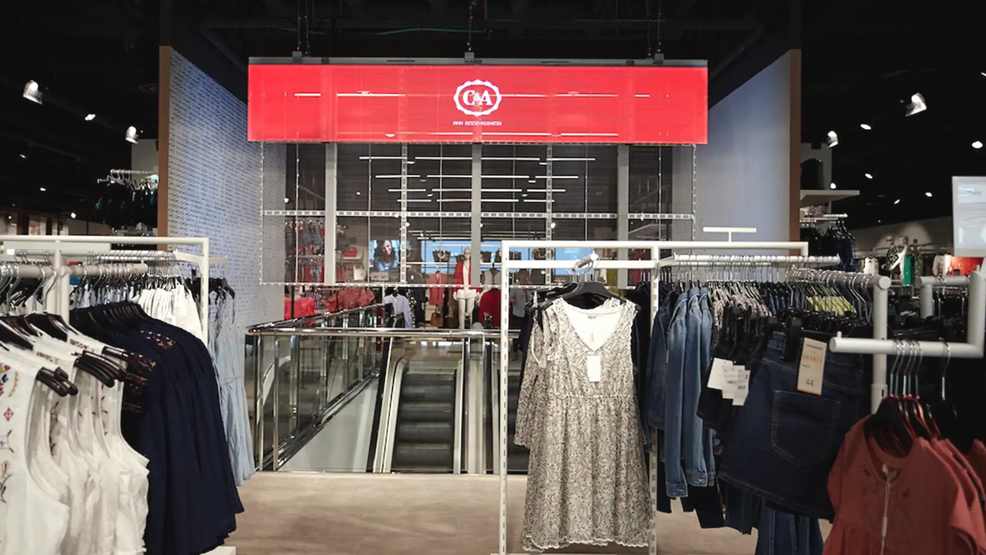Large LED screen at C&A store entrance displaying promotional content.