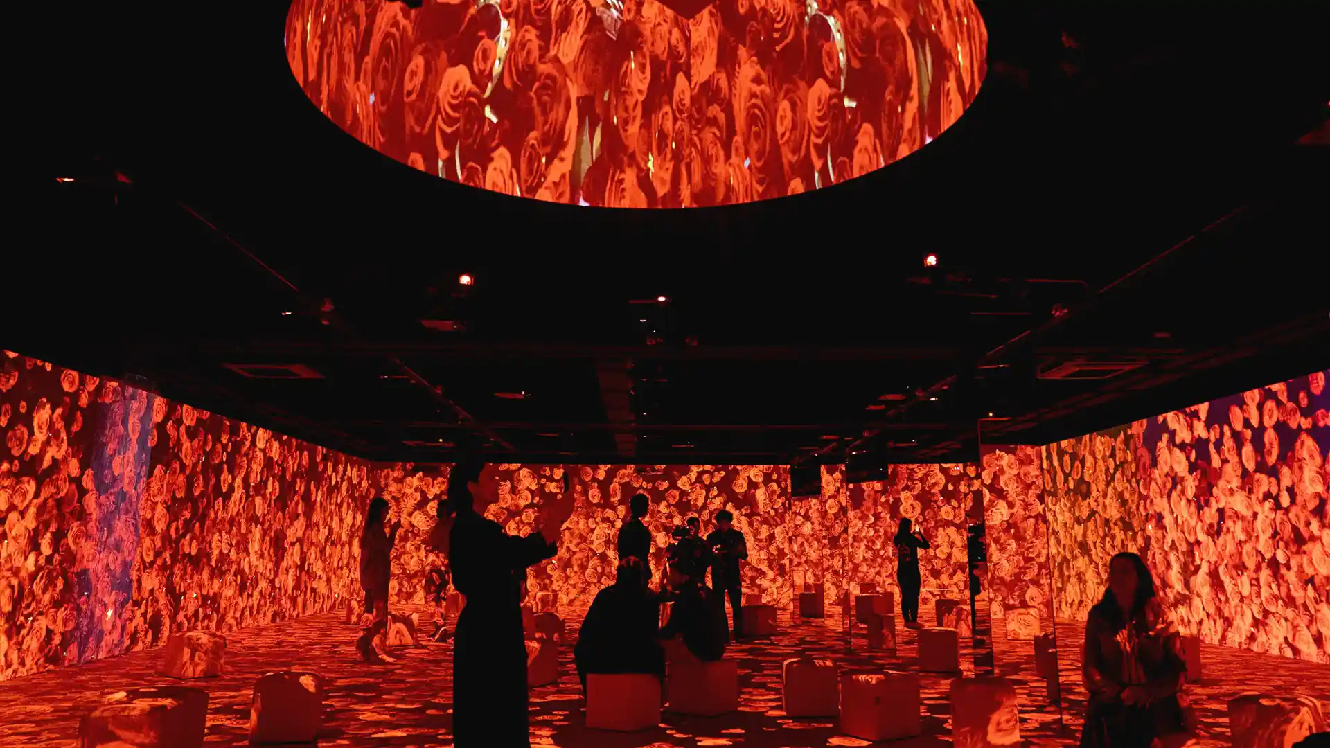 Visitors exploring an immersive digital installation inside Casa Amatller.