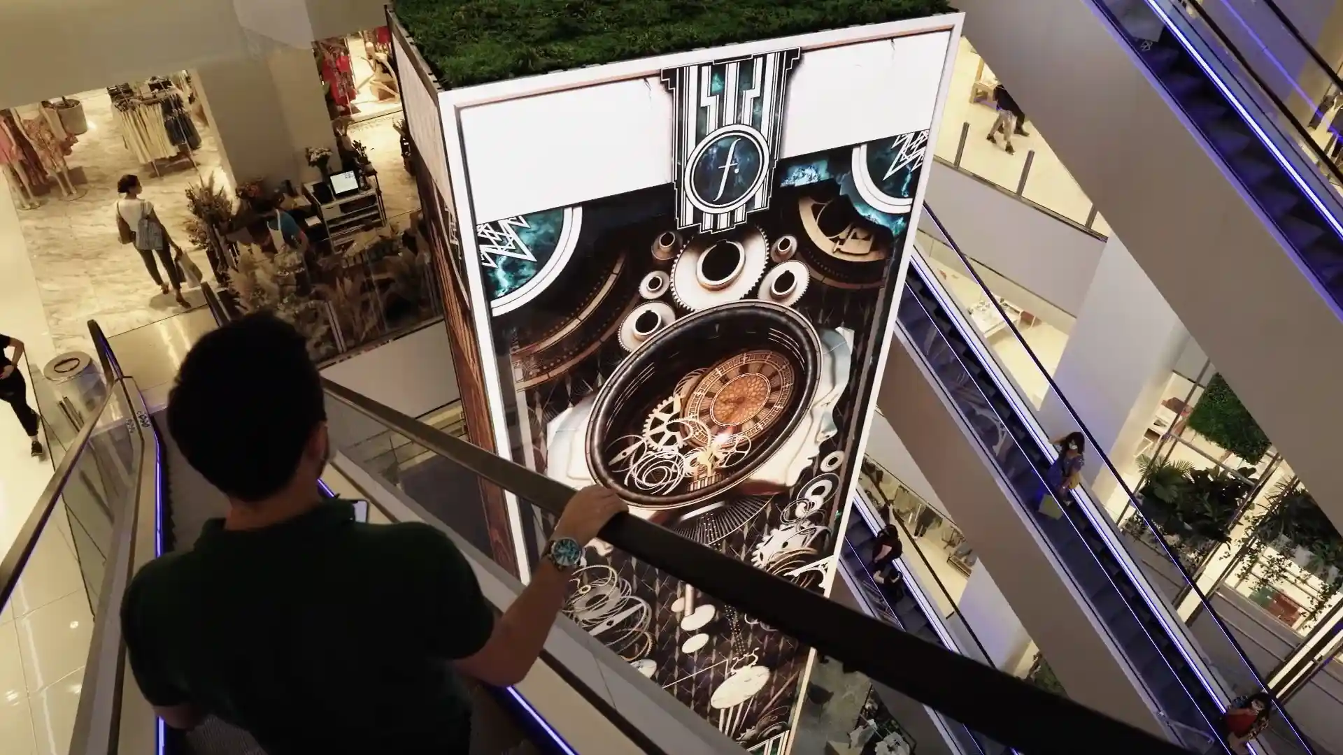 Visitors observing Falabella’s digital installation in the flagship store.