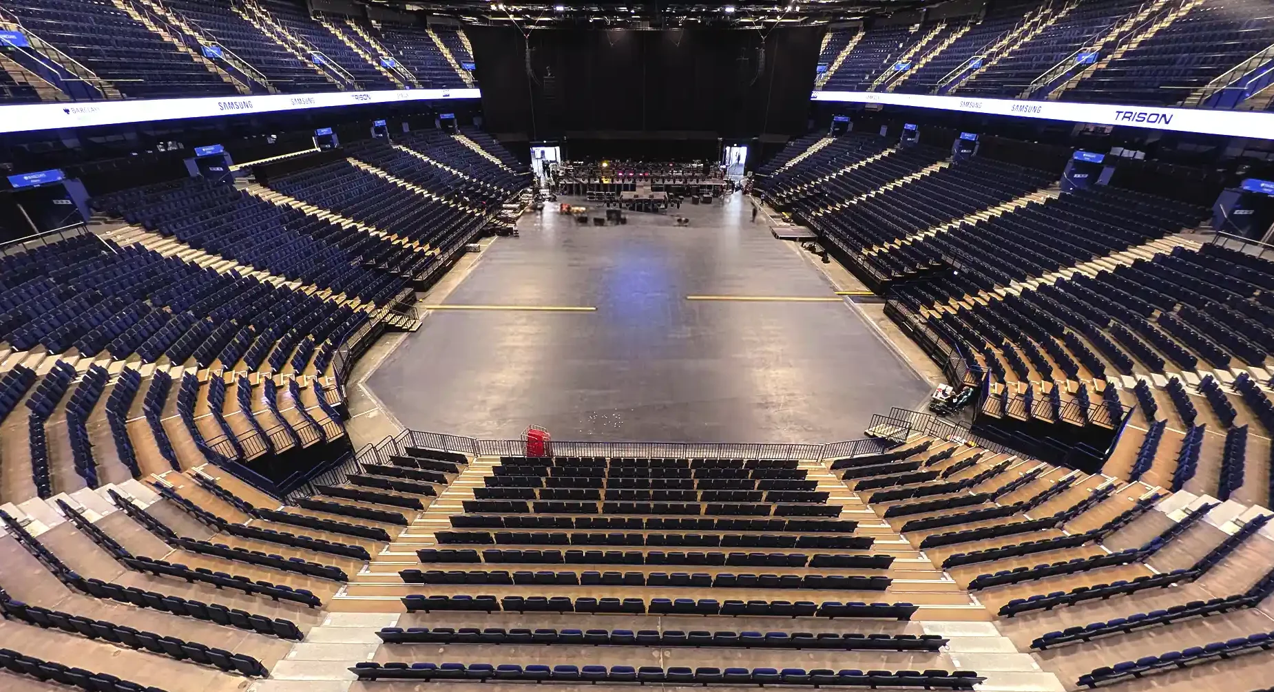 Large-scale LED fascia board integrated into the upper seating tier at Barclays Arena in Hamburg.