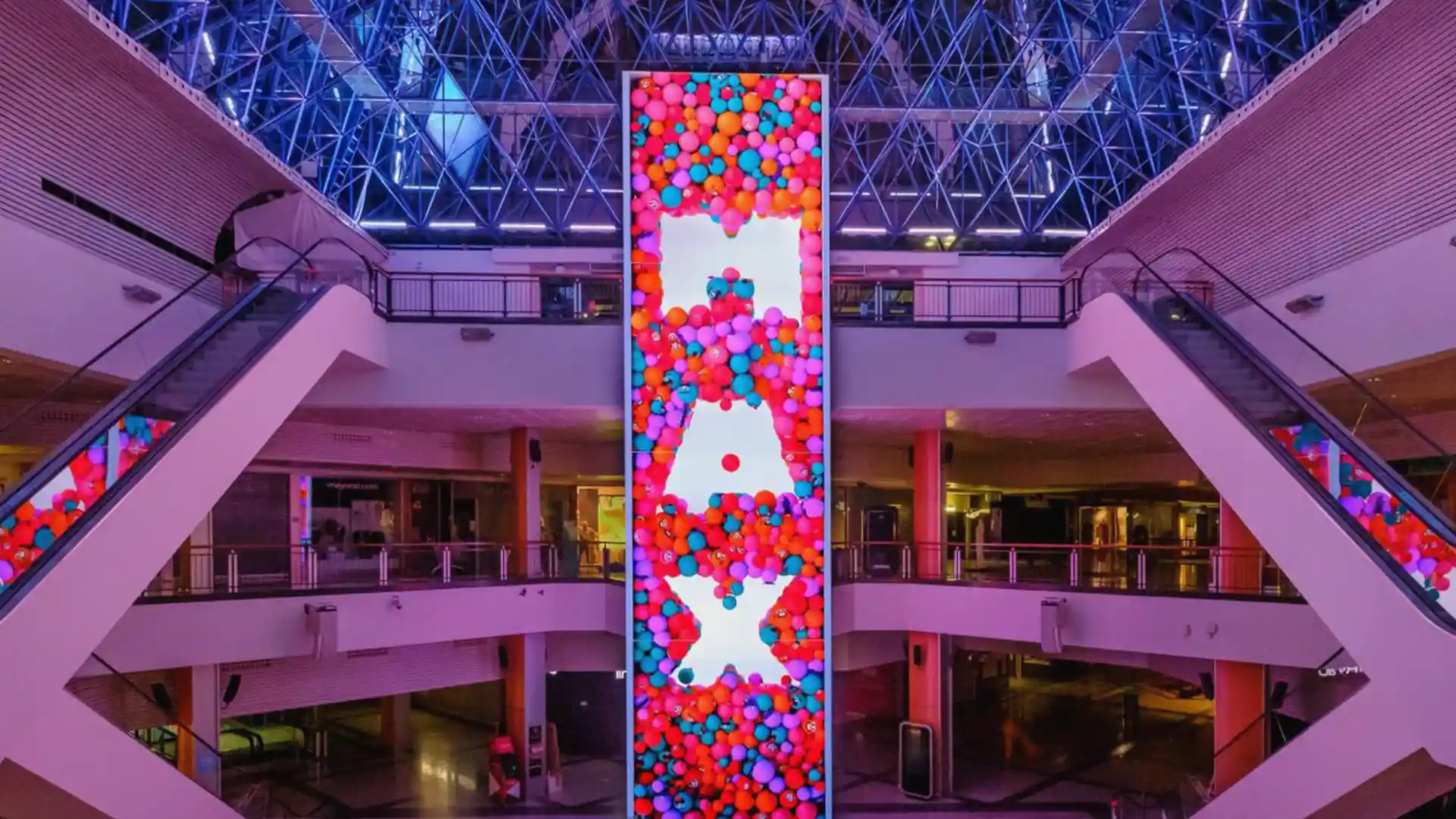 Large-format digital totem designed by TRISON as the core of Max Center’s immersive experience