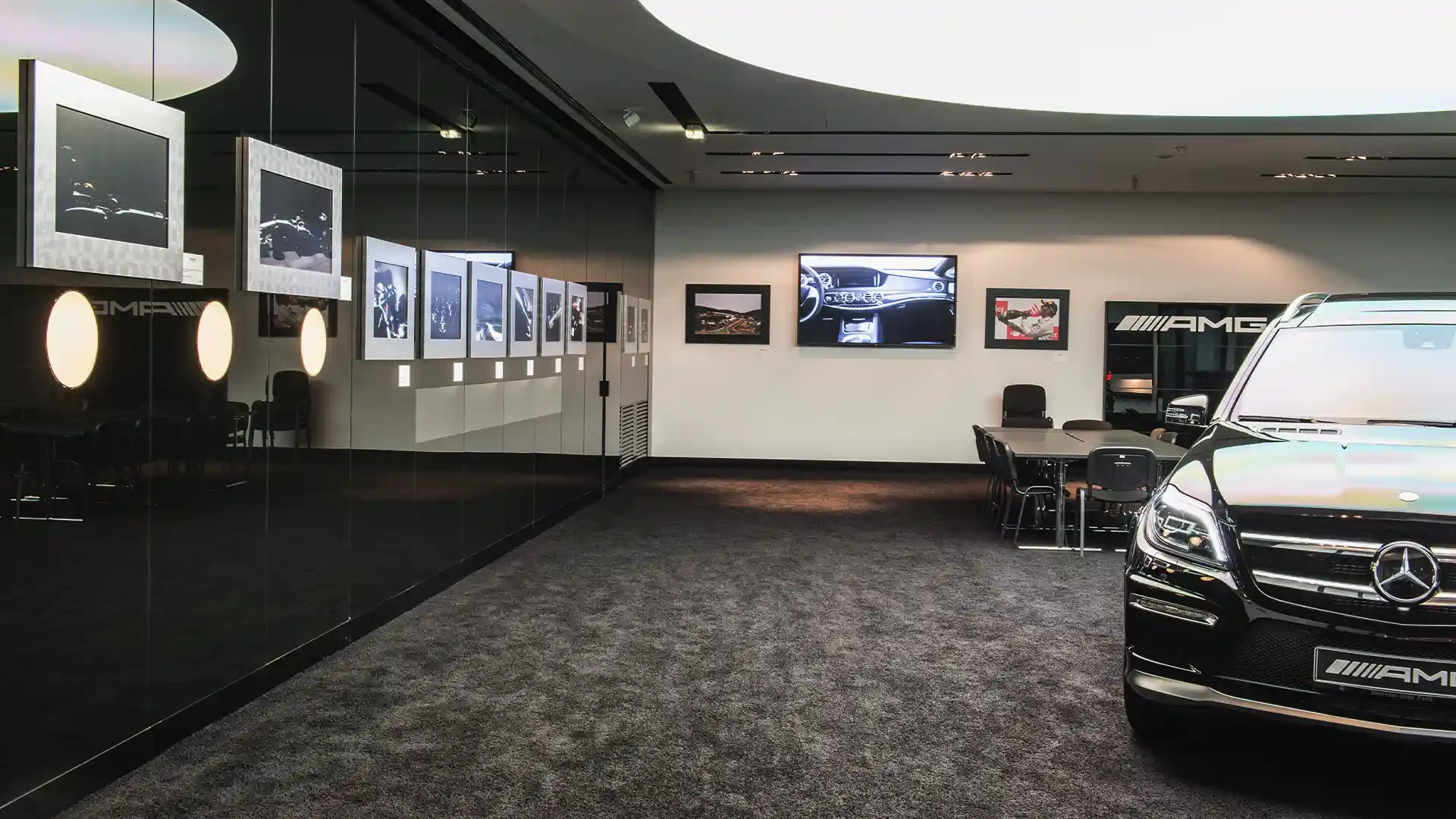 Mercedes-Benz dealership interior equipped with coordinated digital displays delivering consistent brand communication.