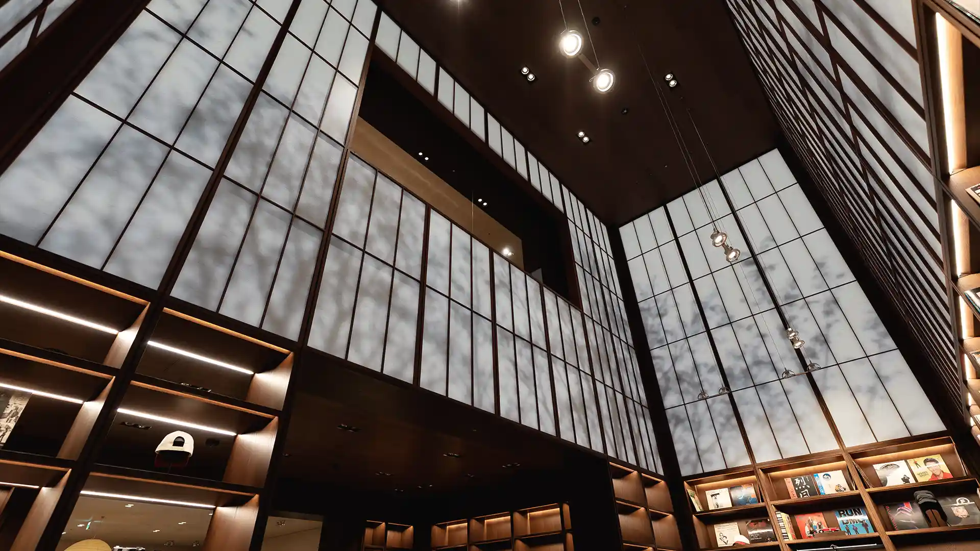 Double-height retail space at Zara Man Osaka connected by an integrated audiovisual installation